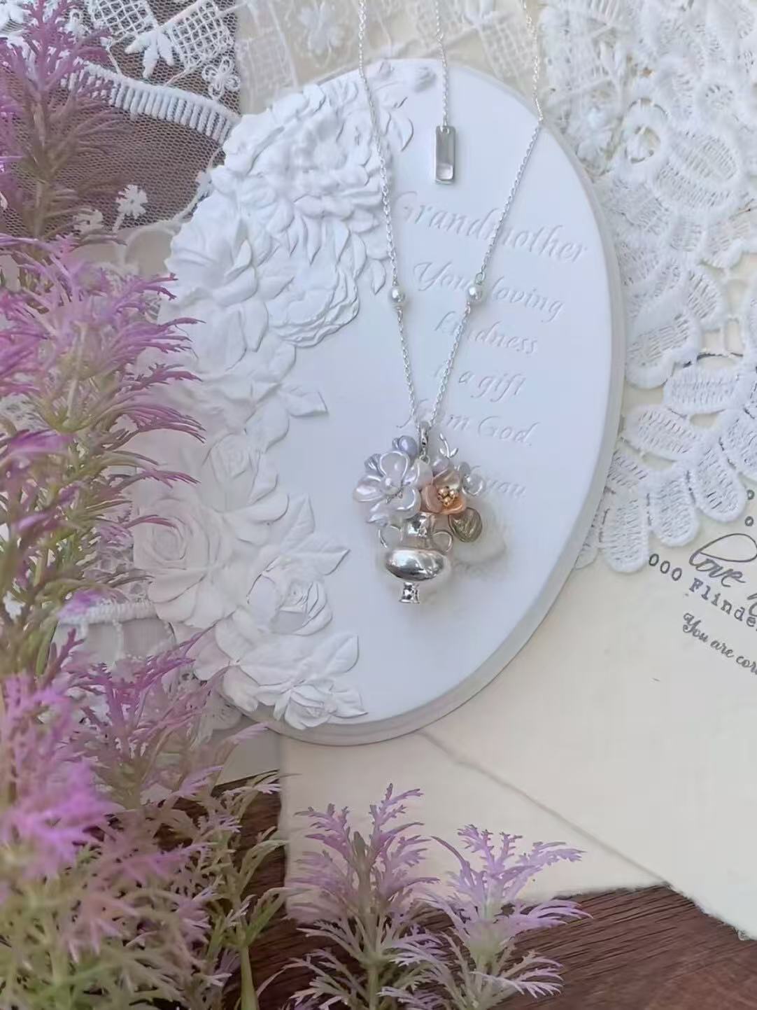 Silver vase pearl necklace