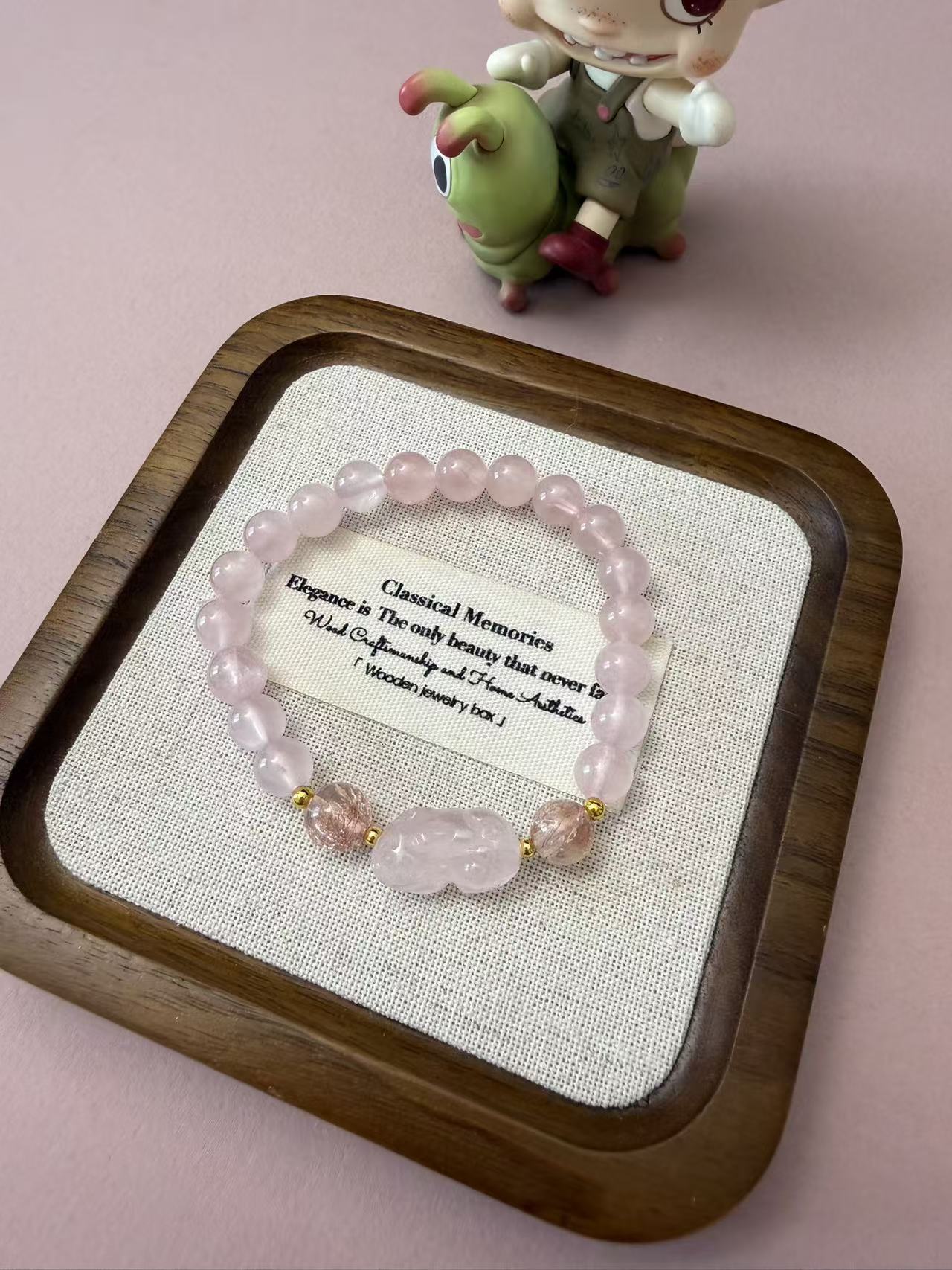 Soft rose quartz beaded bracelet with a carved pixiu charm and strawberry quartz accents, a dainty crystal piece for love, luck, and everyday styling. B365