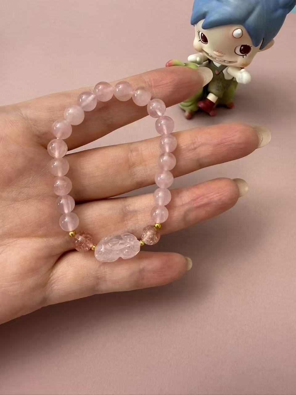 Soft rose quartz beaded bracelet with a carved pixiu charm and strawberry quartz accents, a dainty crystal piece for love, luck, and everyday styling. B365