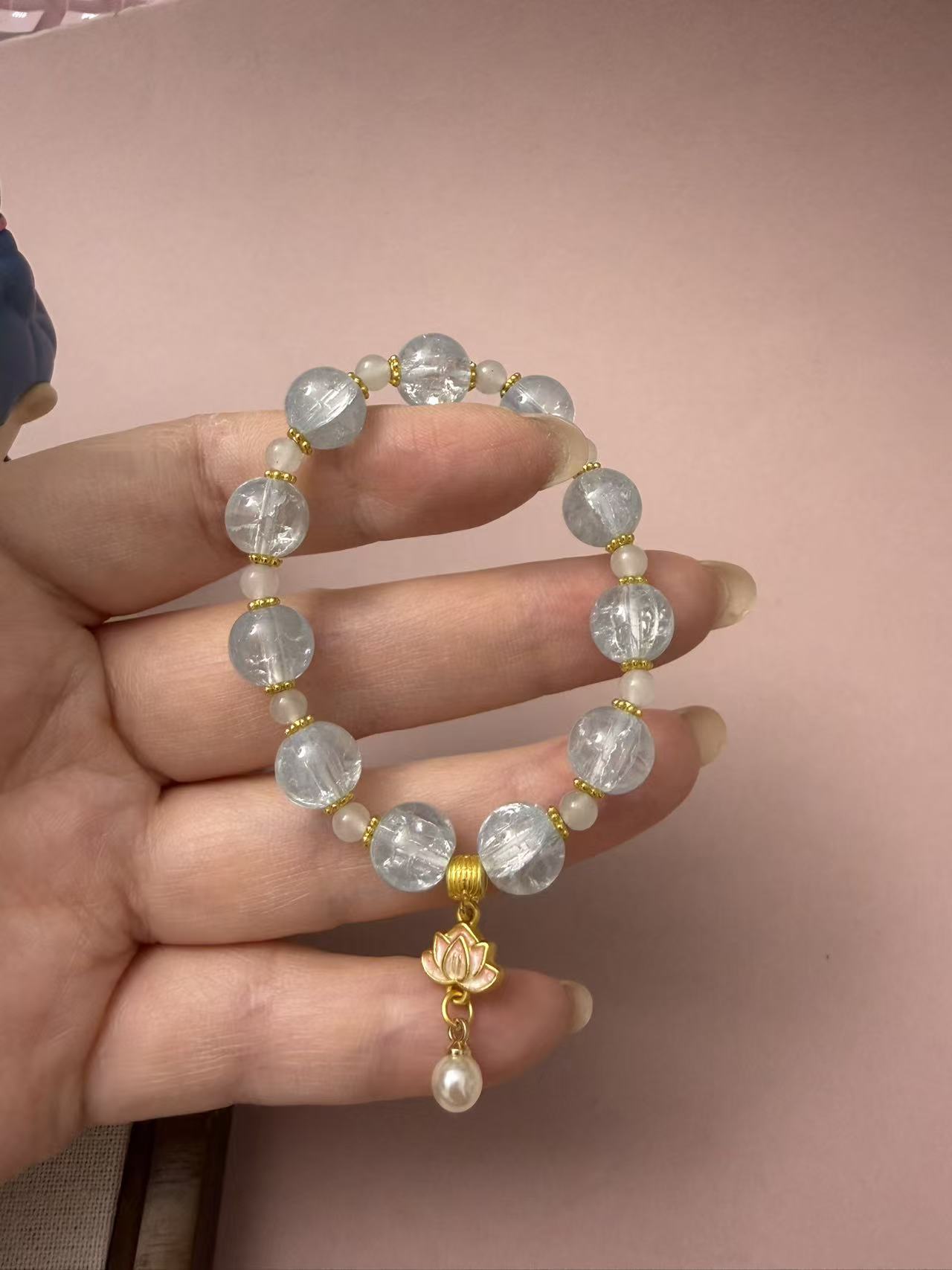 Soft light blue glass bead bracelet with a sweet lotus pearl charm. Minimalist dreamy jewelry for women, ideal for everyday wear or as a cute gift. B111