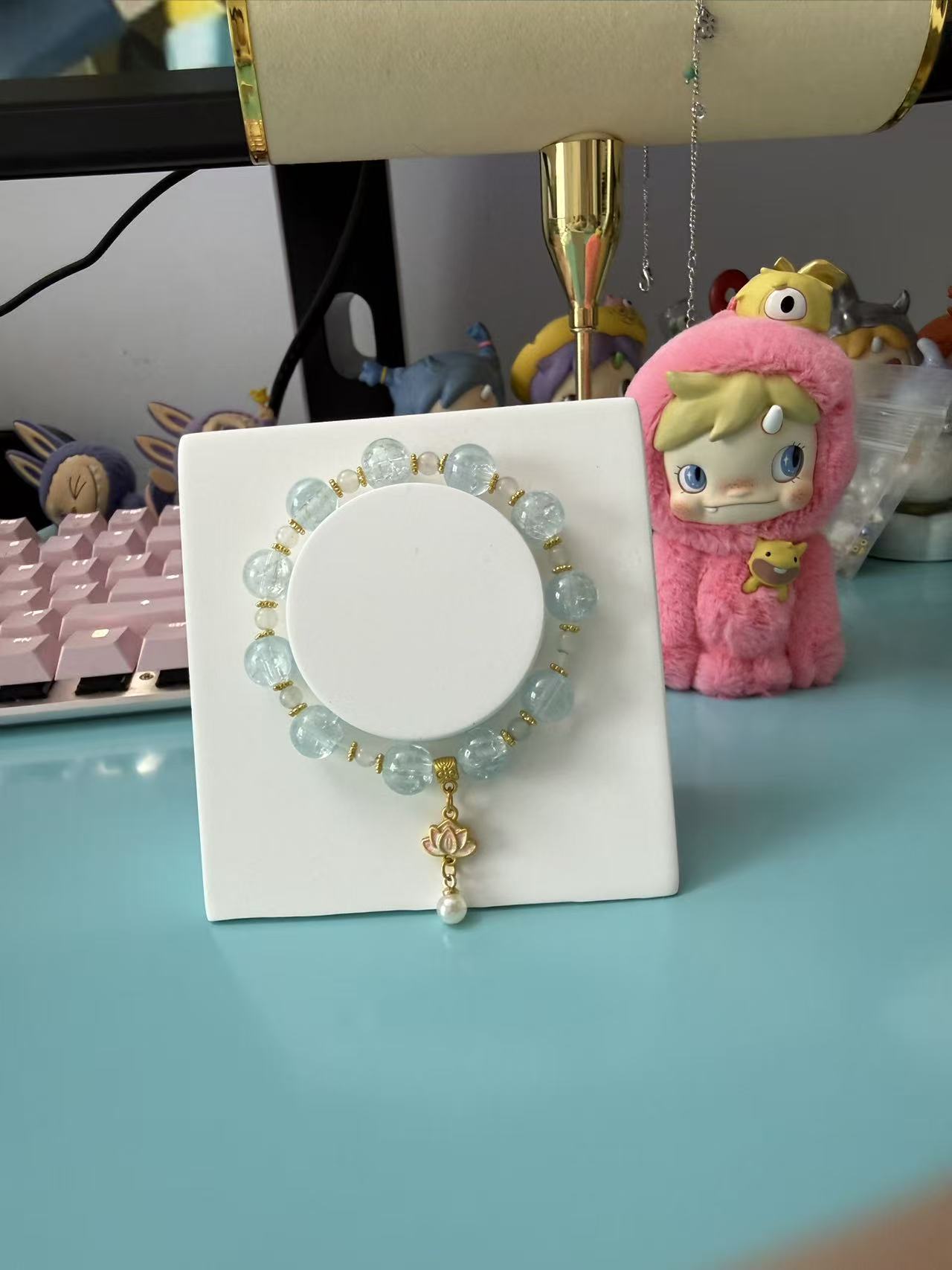 Soft light blue glass bead bracelet with a sweet lotus pearl charm. Minimalist dreamy jewelry for women, ideal for everyday wear or as a cute gift. B111